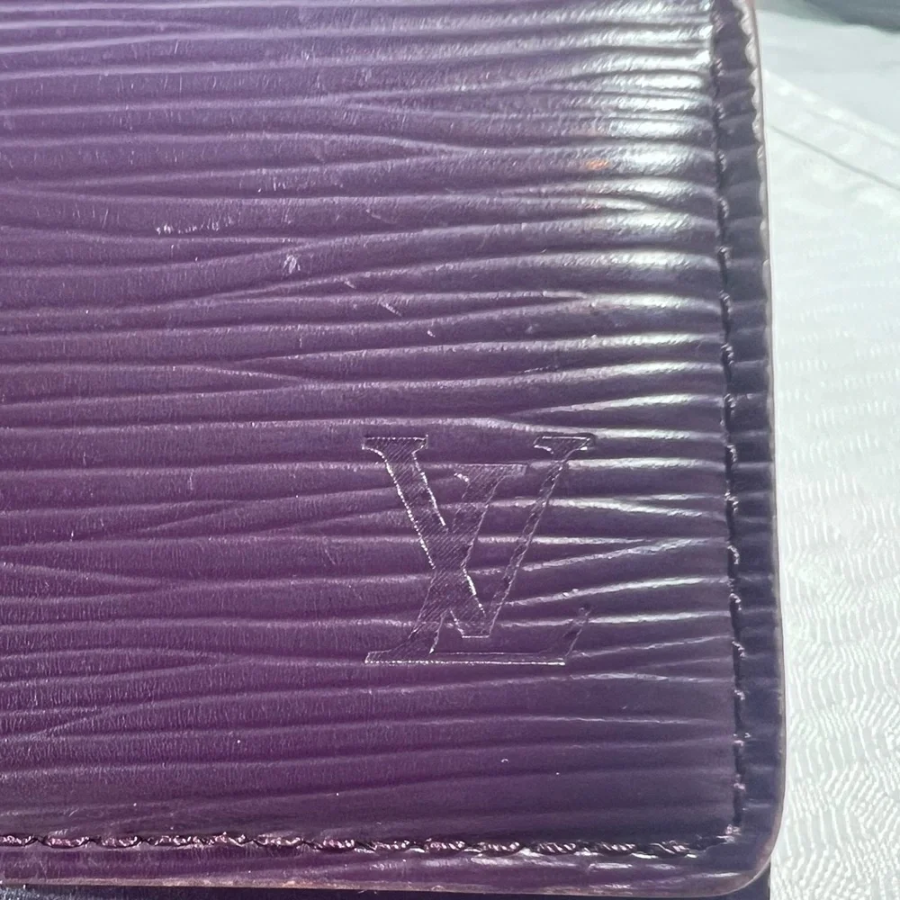 1136: Louis Vuitton Epi Leather Trifold Wallet Purple